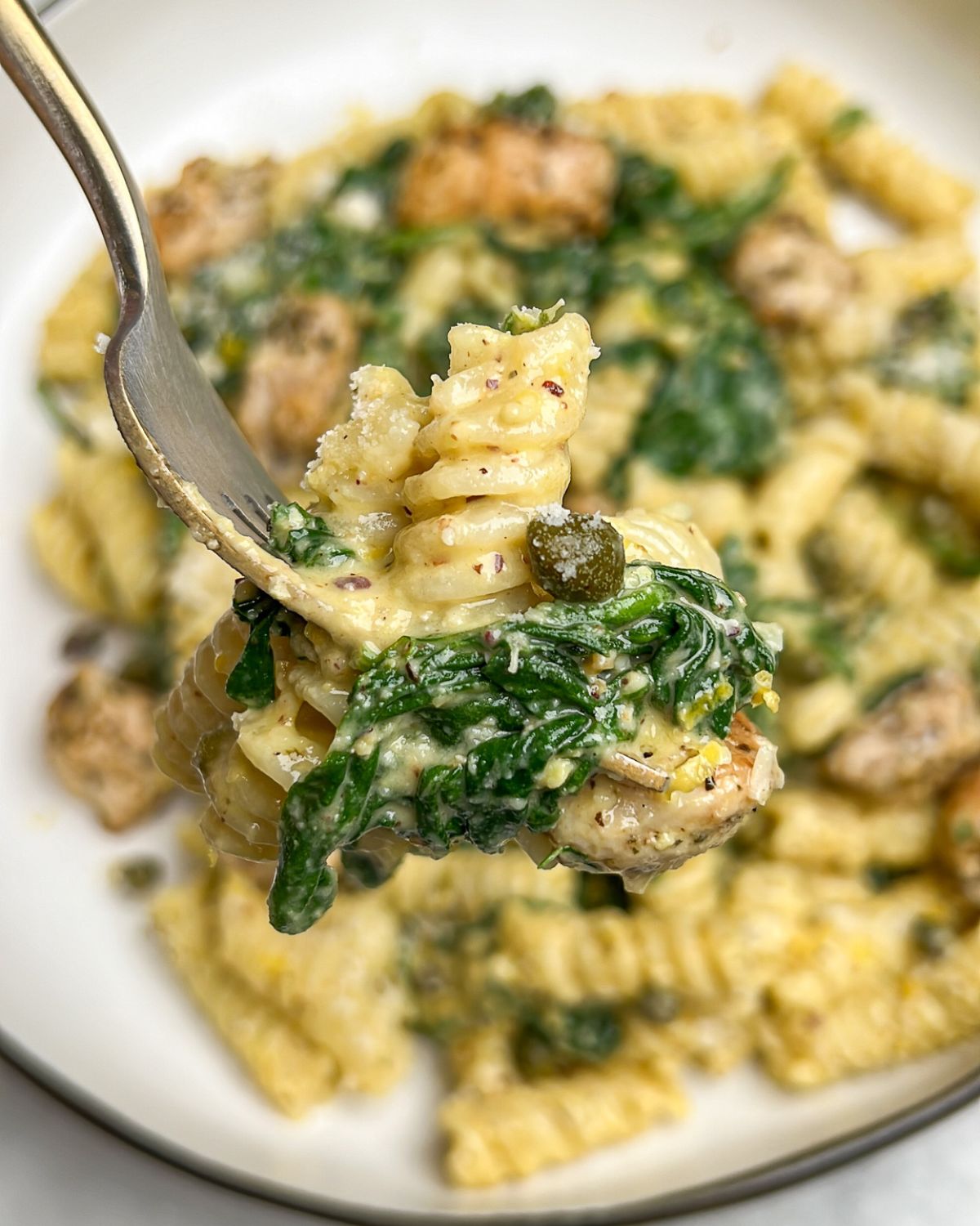 chicken pesto pasta on a fork