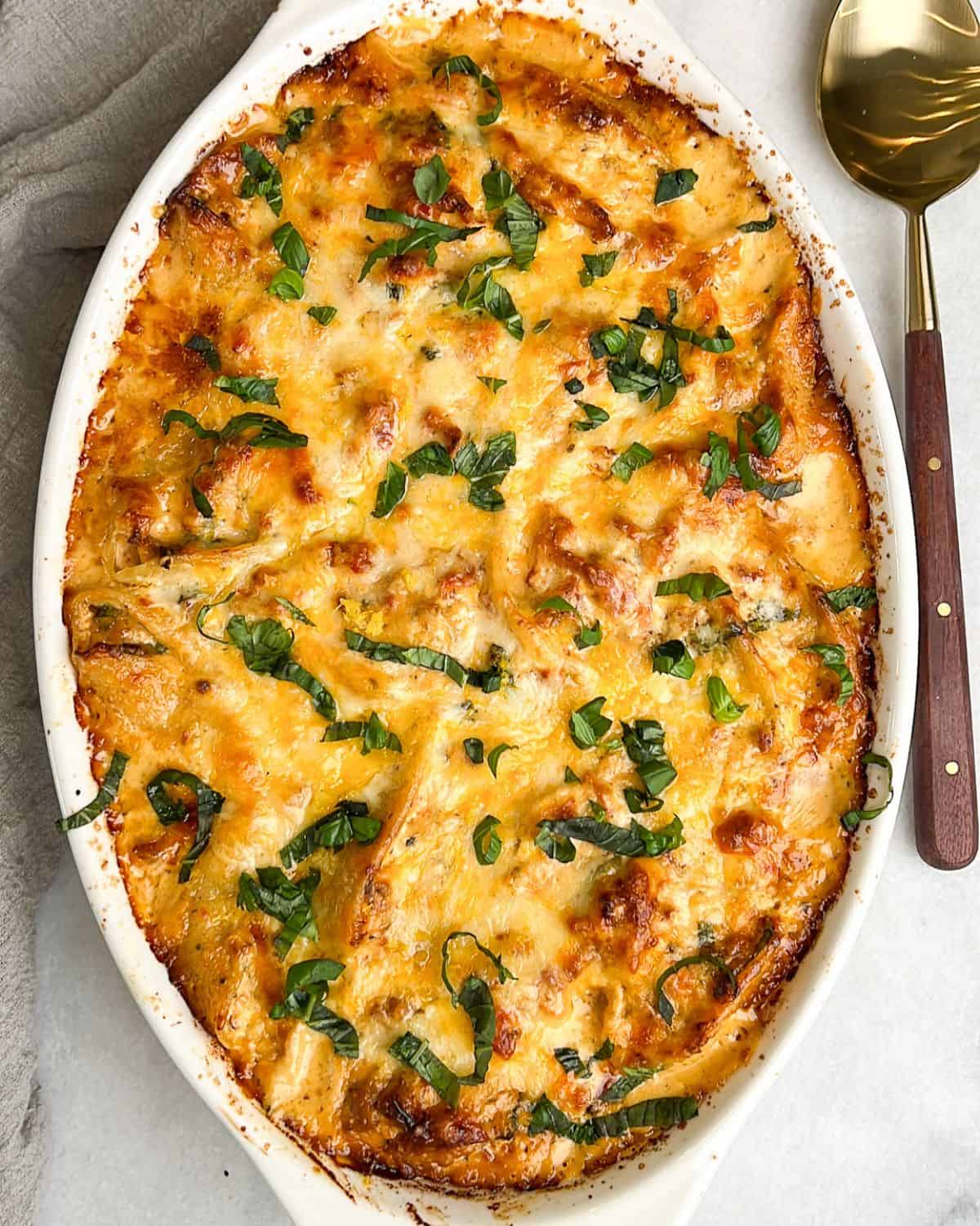 Marry me chicken stuffed shells in a baking dish.