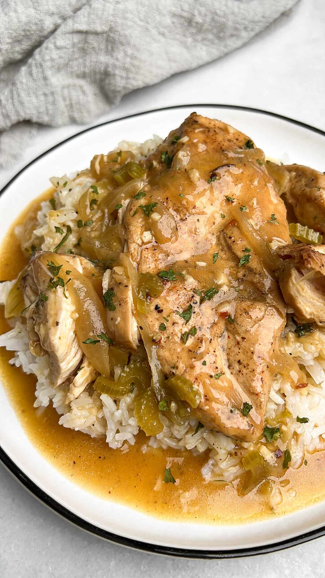 Smothered chicken served over rice.