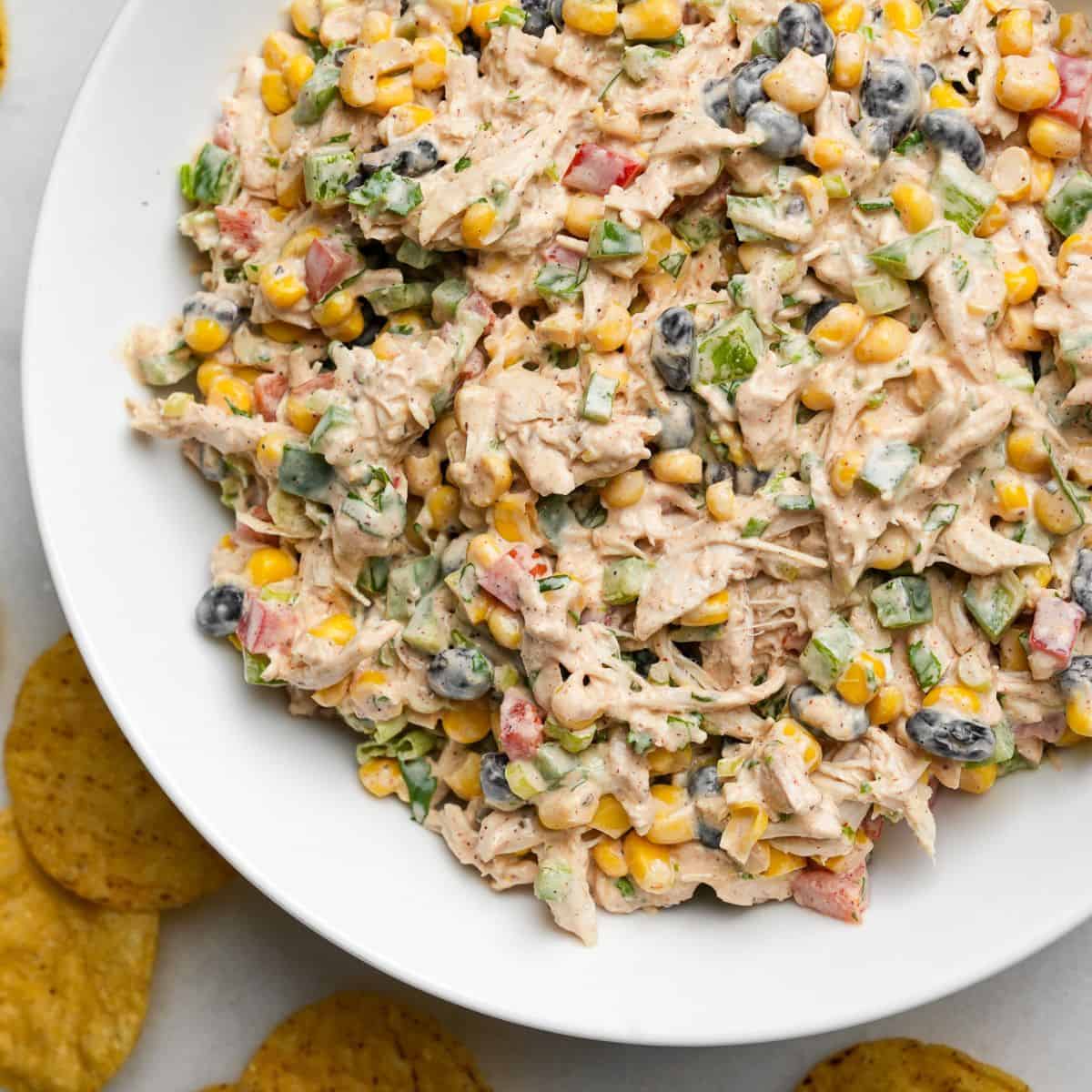 chicken salad in a bowl with tortilla chips