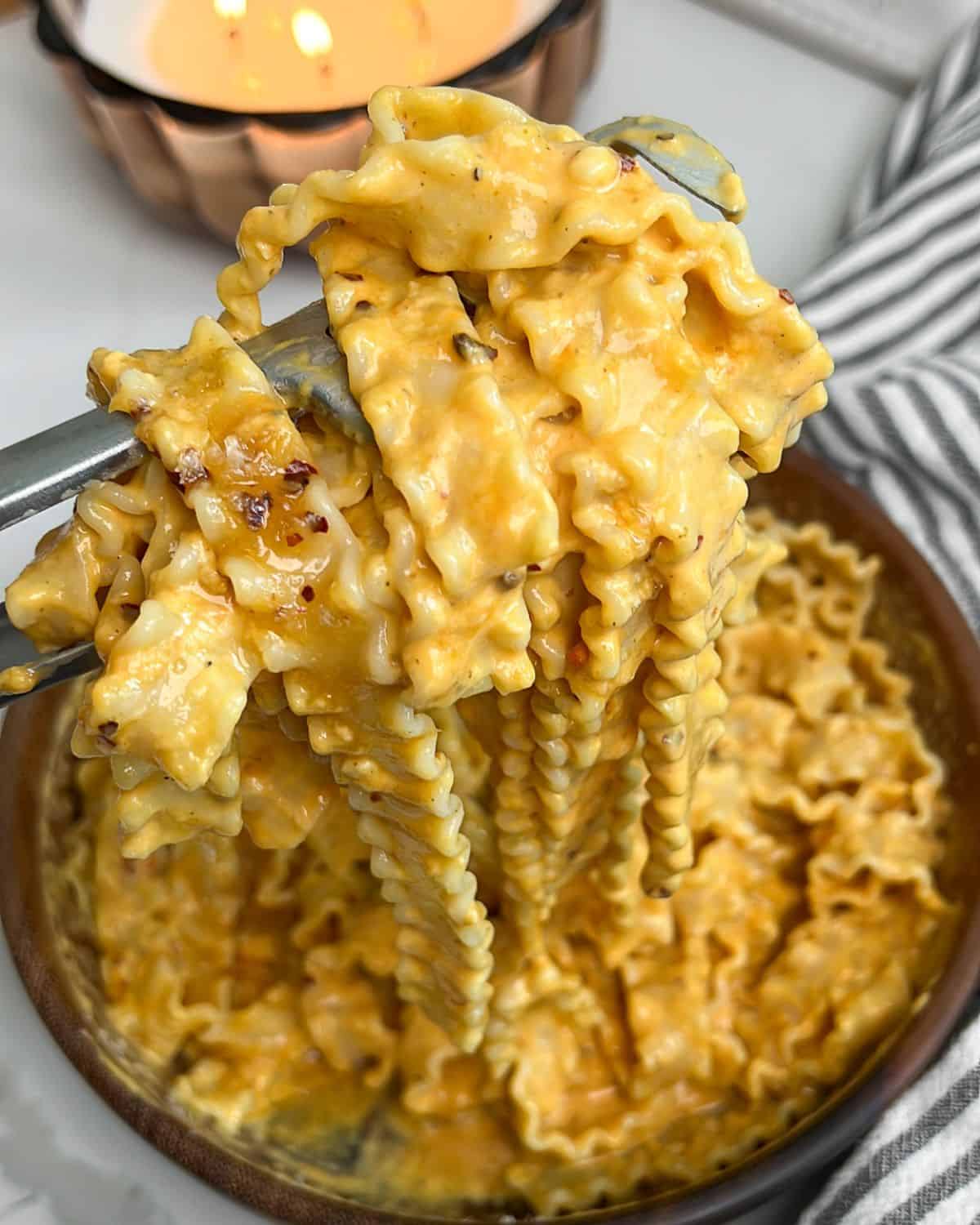 pasta on a fork being pulled out of a bowl