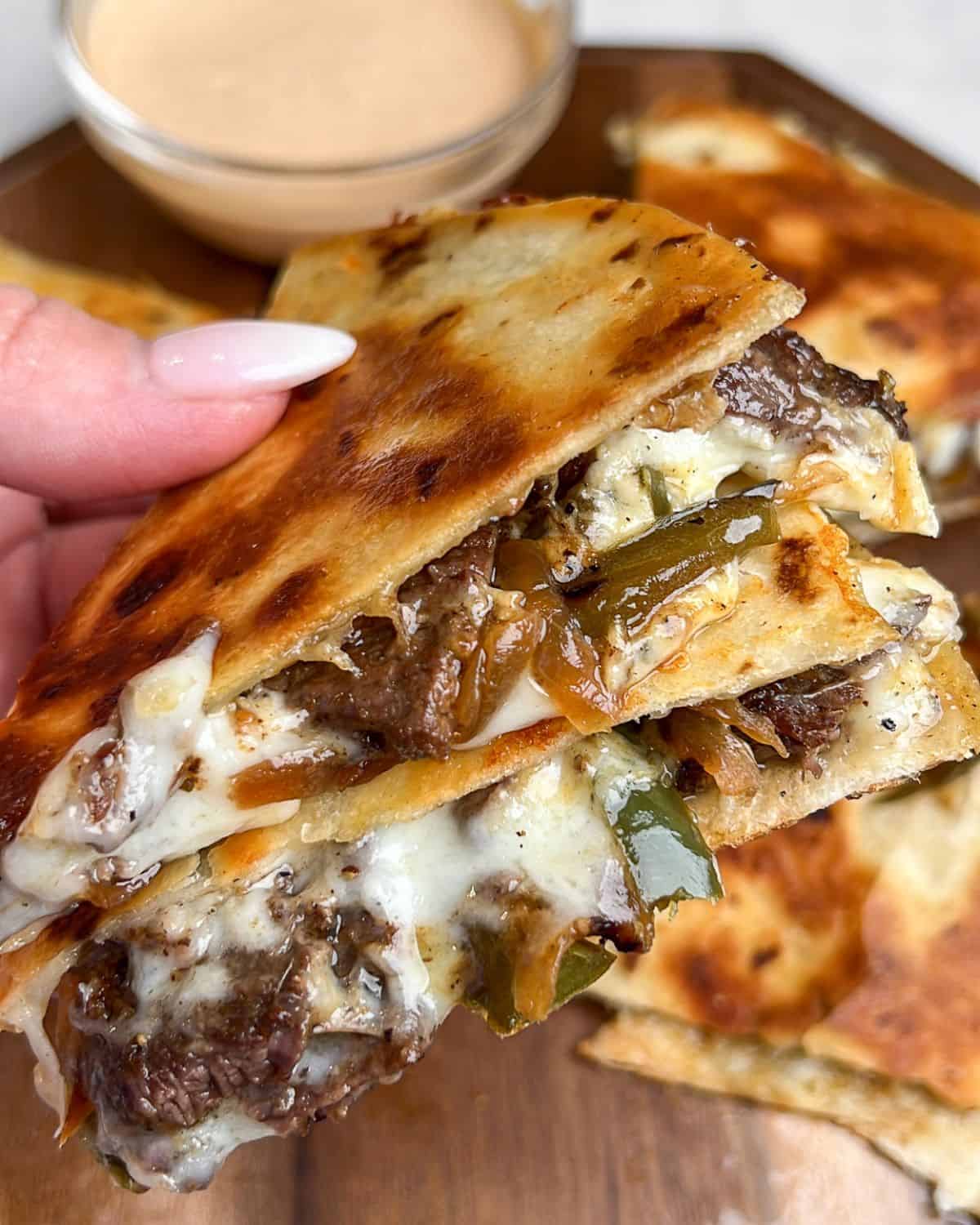 side view of steak quesadillas with melted cheese
