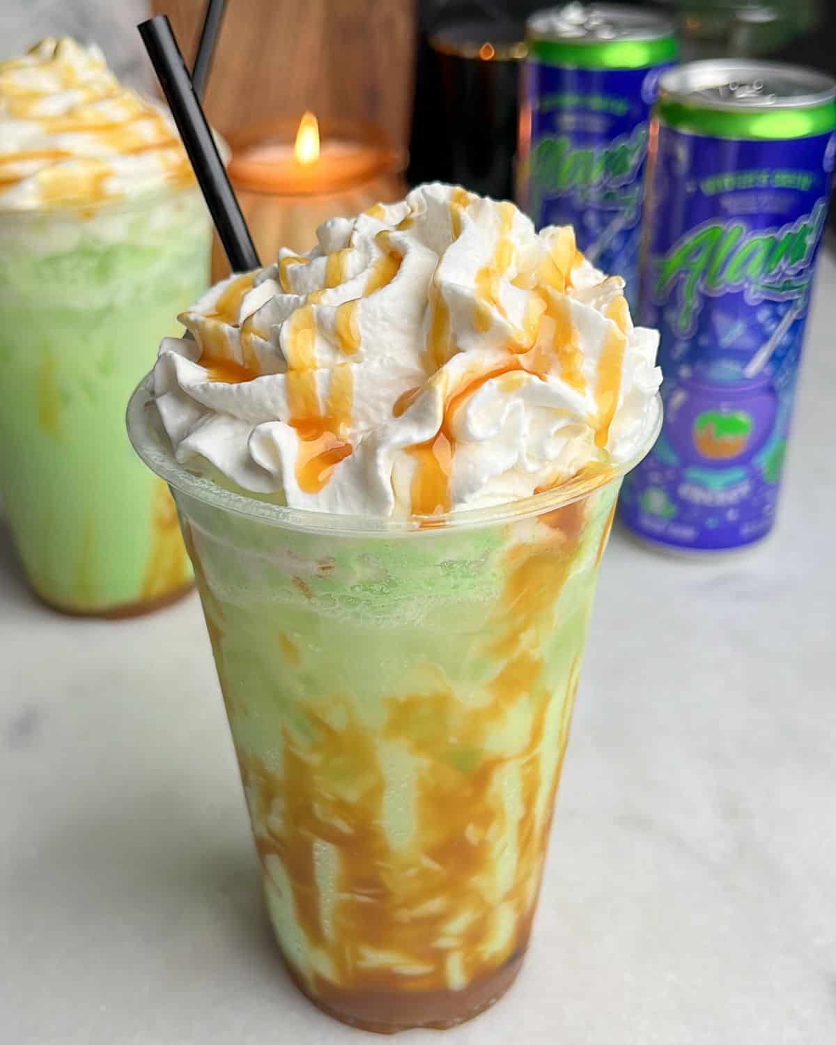 caramel apple drink with whipped cream on a counter