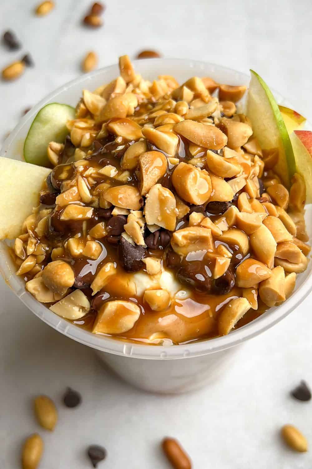 featured image of apples peanut butter and caramel in a container.