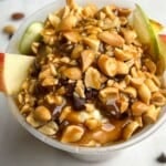 featured image of apples peanut butter and caramel in a container.