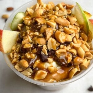 featured image of apples peanut butter and caramel in a container.
