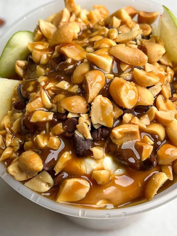 featured image of apples peanut butter and caramel in a container.