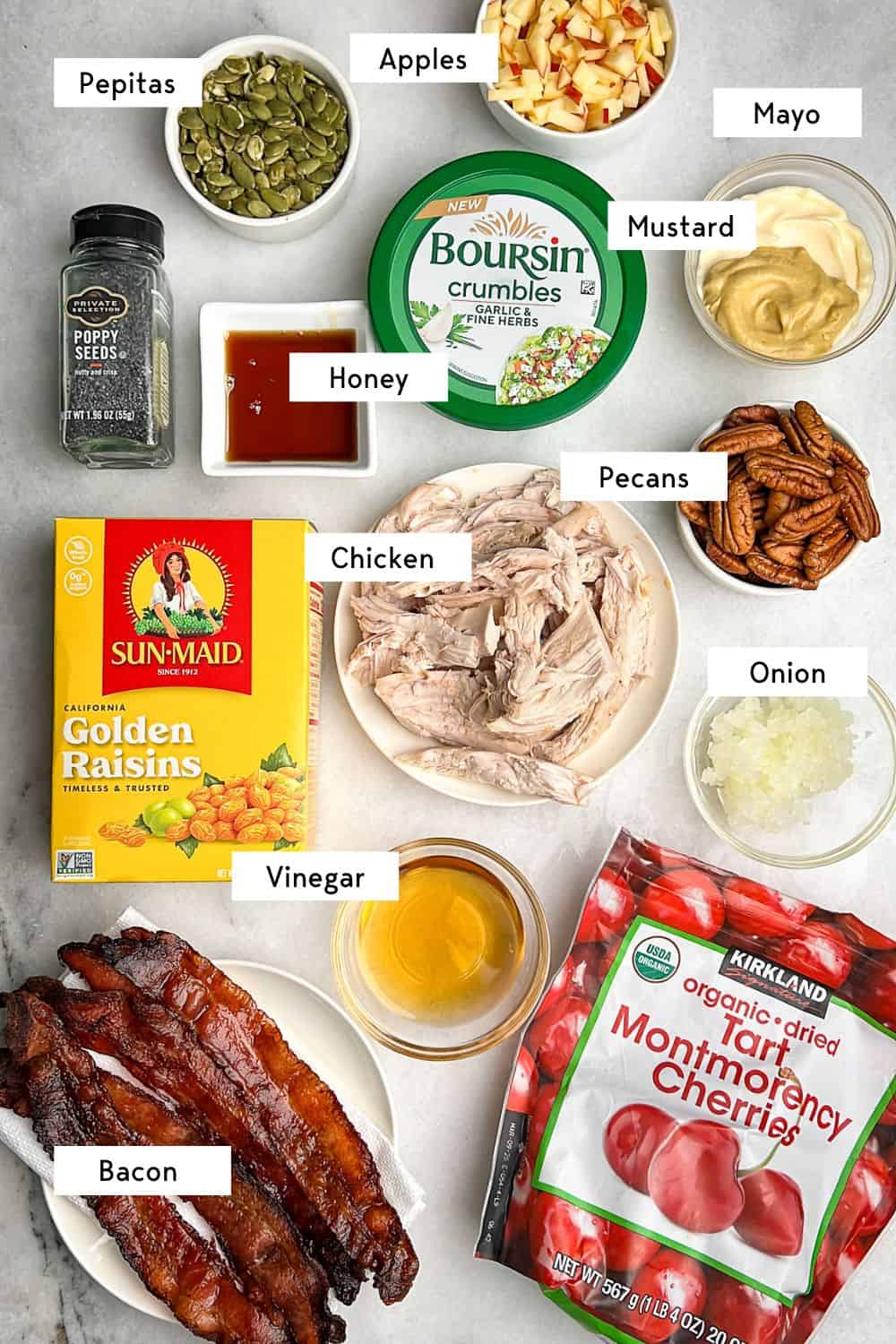 Labeled ingredients for autumn chicken salad with apples.