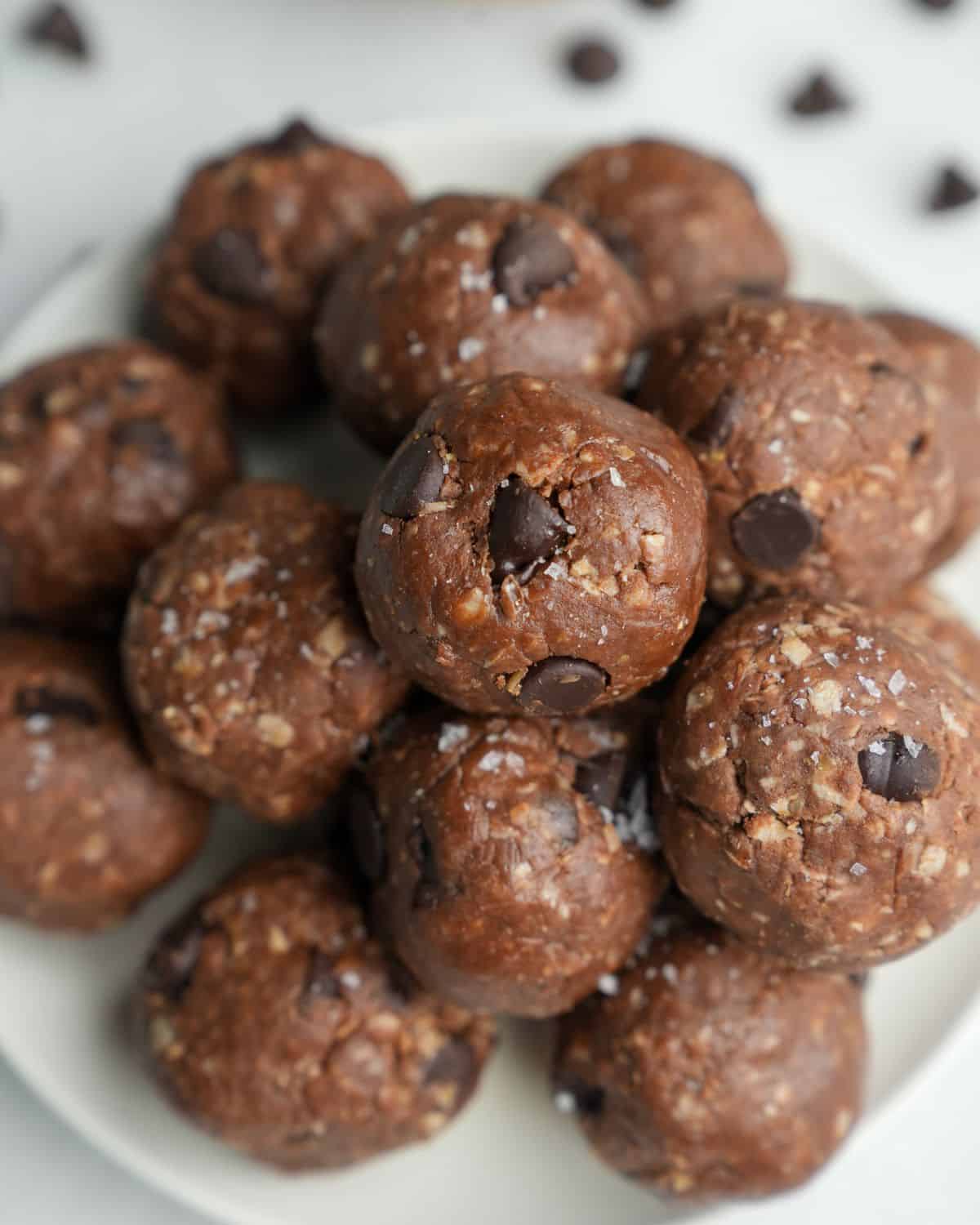 A pile of chocolate peanut butter protein balls on a plate.