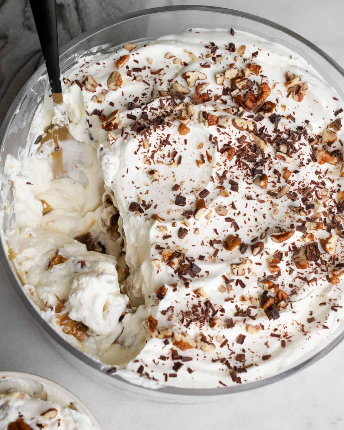 dessert trifle being scooped out with a spoon