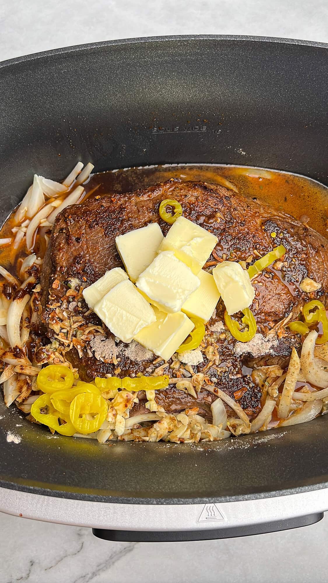 ingredients for Mississippi pot roast in a slow cooker