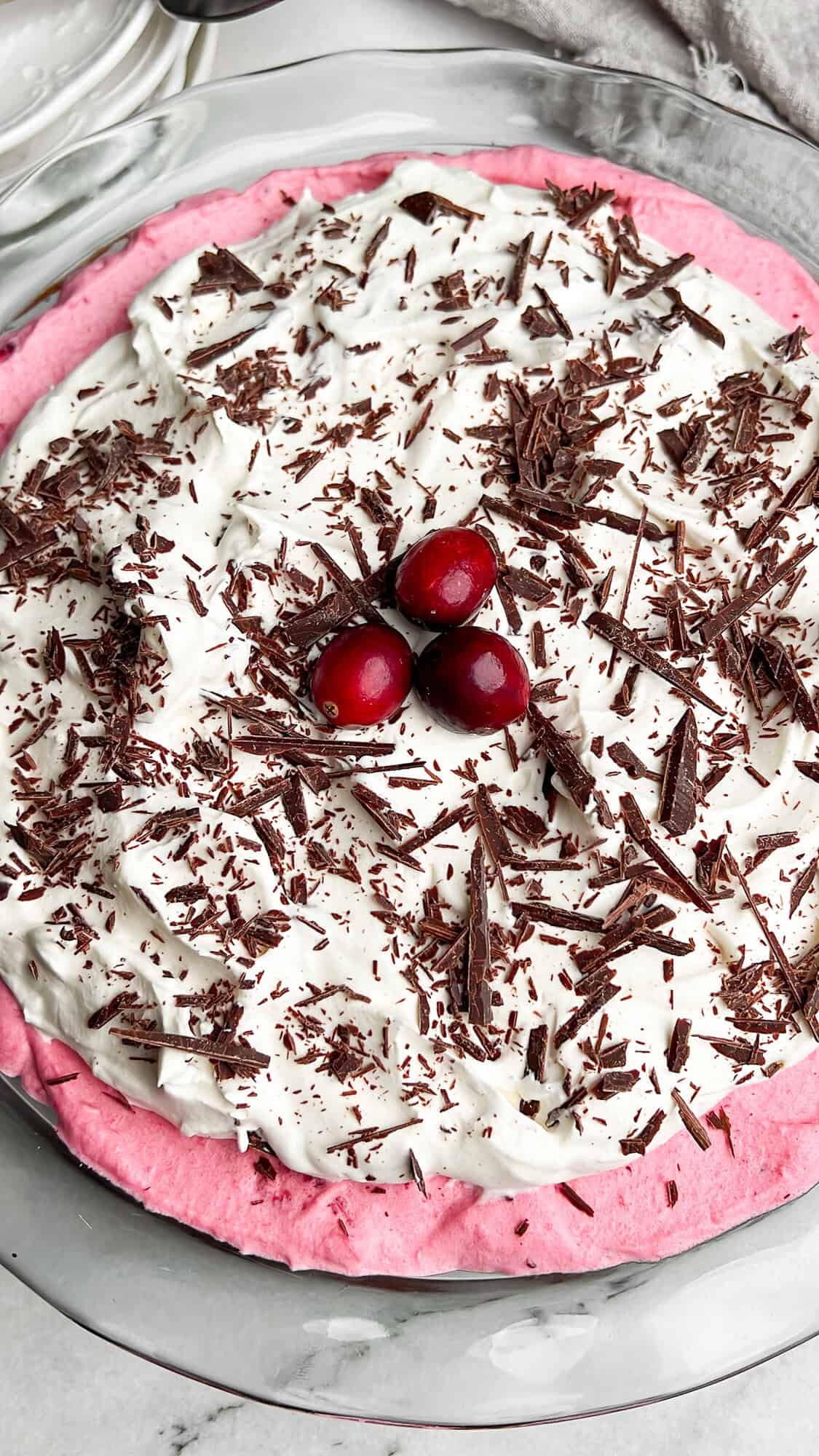 cranberry cream pie with a chocolate brownie crust and chocolate flakes