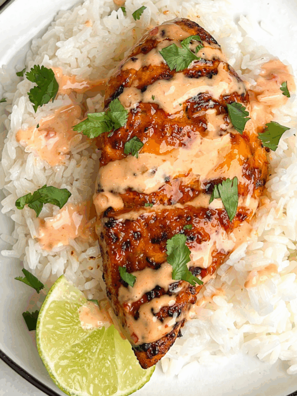 A plate of bang bang chicken over rice