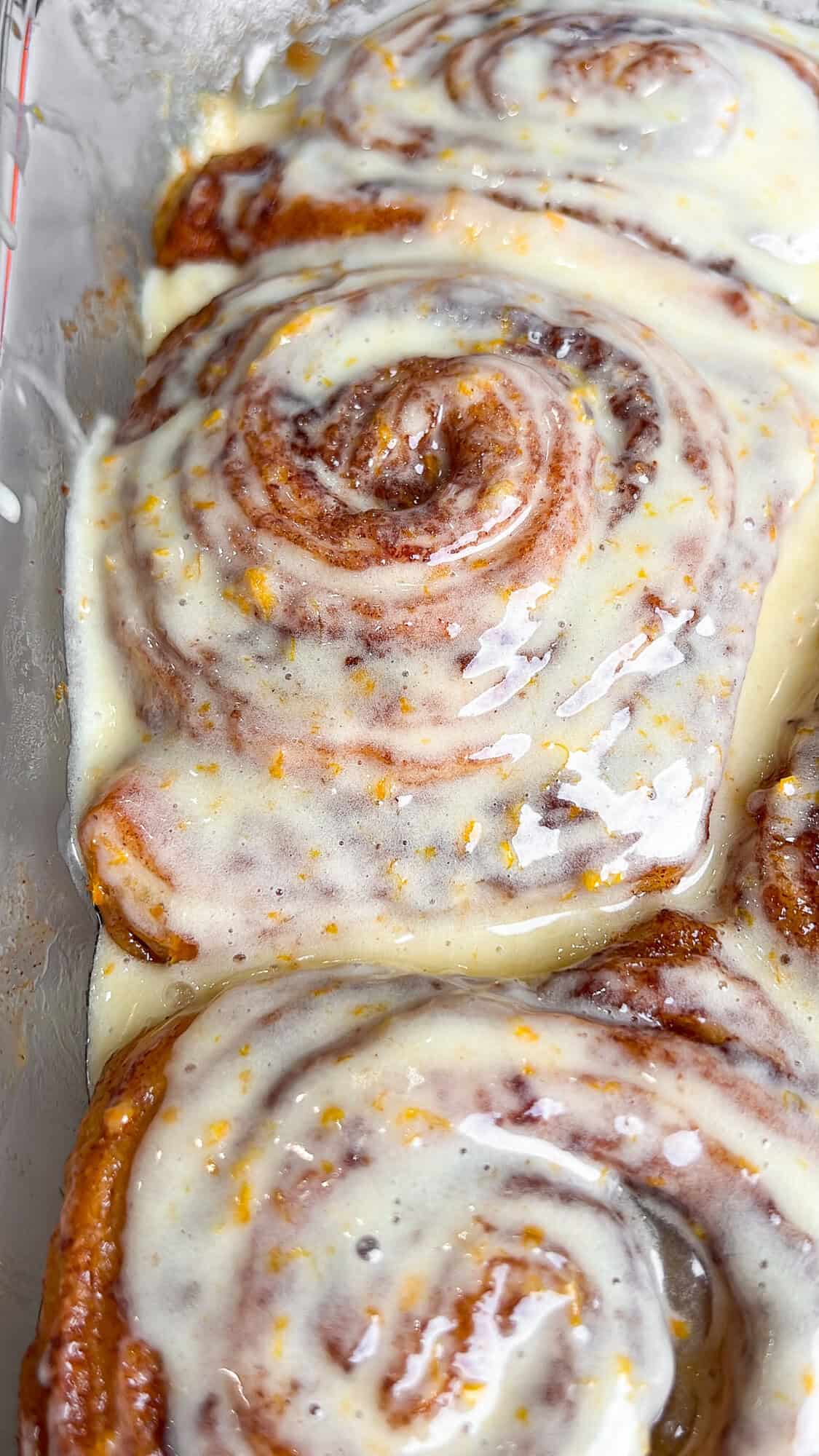 glazed cinnamon rolls in a pan