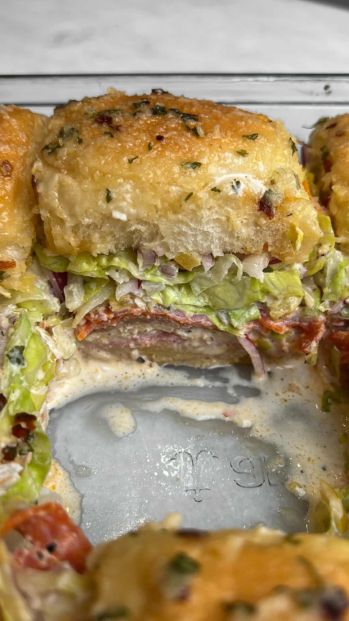 italian grinder sliders inside of a pan