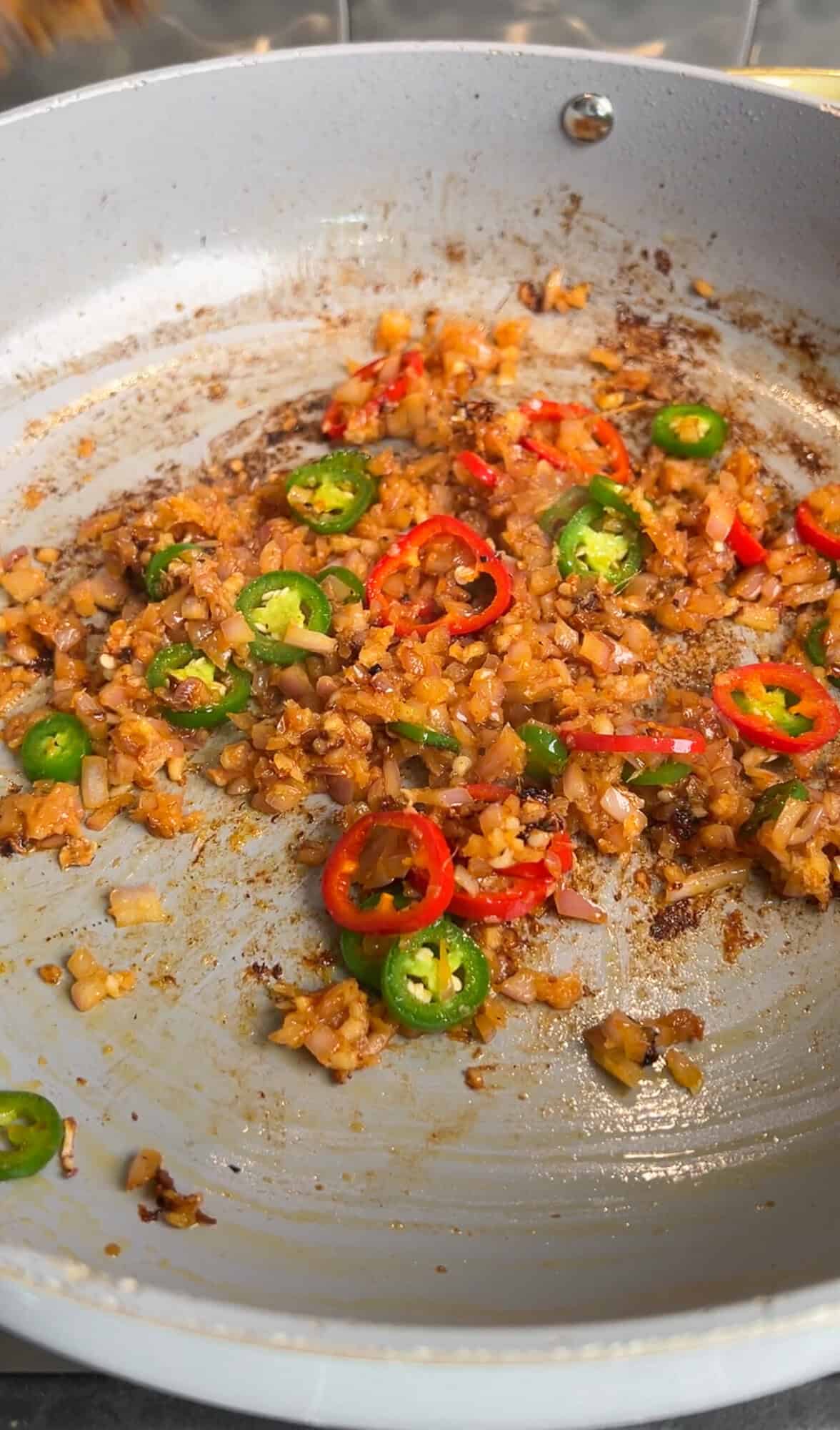 aromatics sautéing in a pan