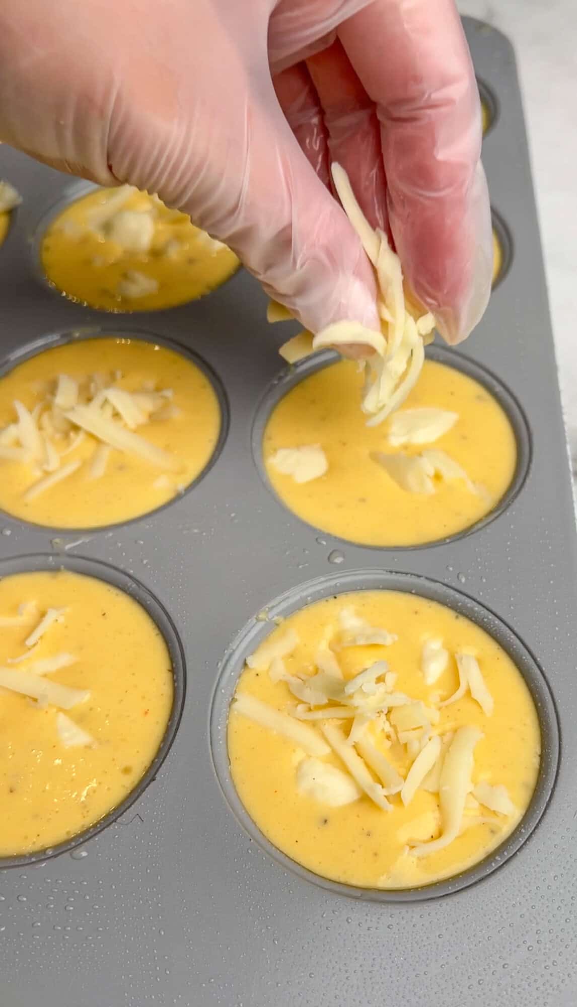 cheese being added to the egg mixture