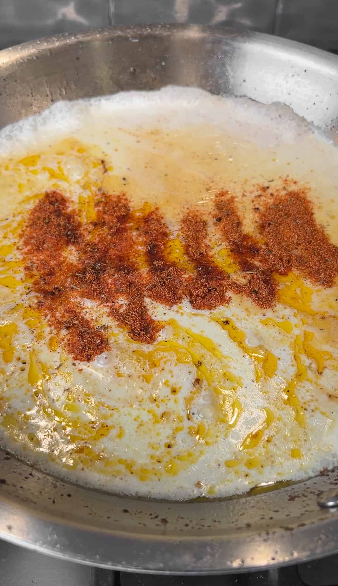 cream and seasonings are added to the pan