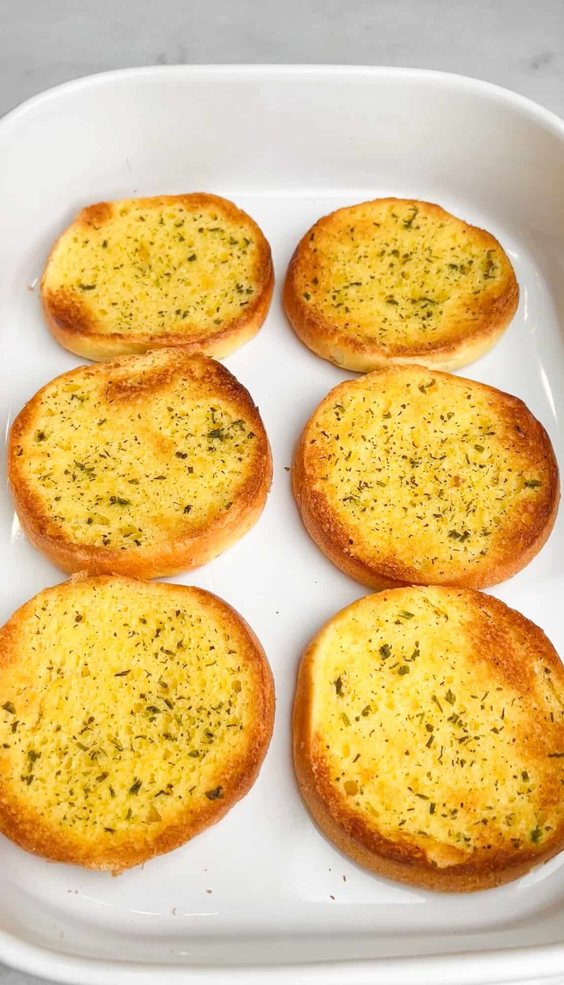 garlic butter toasted buns in a sheet pan