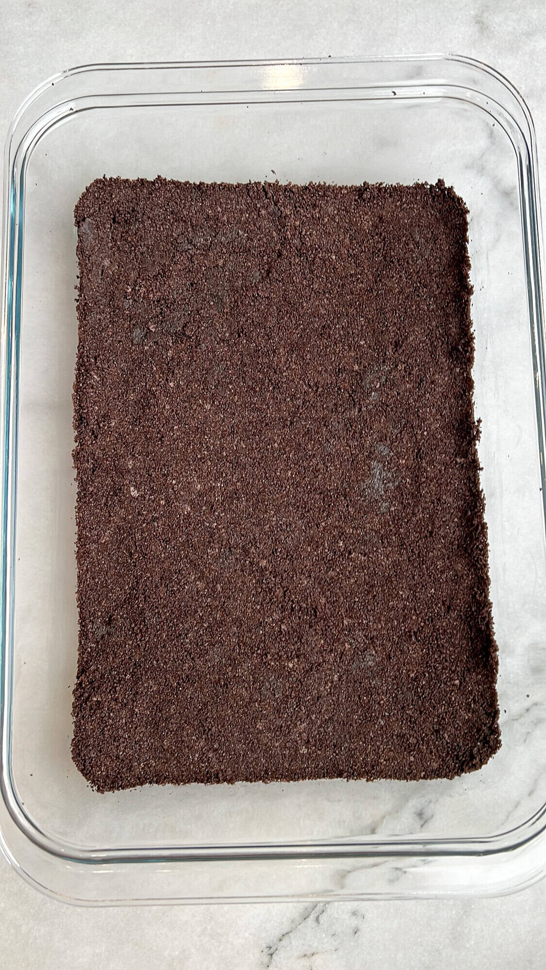 Oreo crust pressed in a pan