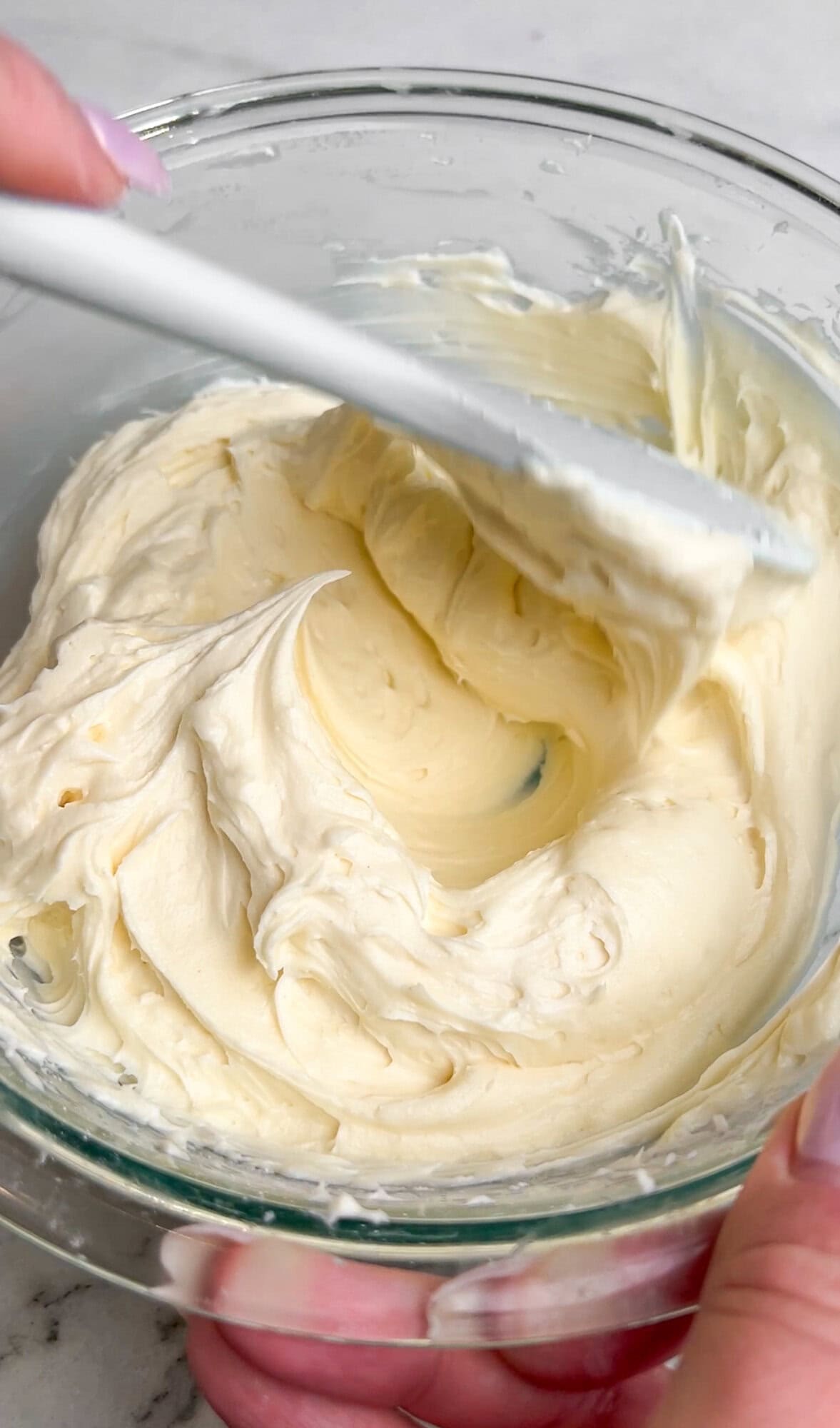 Oreo delight has an Oreo crust with creamy, no-bake layers of ganache, cream cheese, pudding, and whipped cream. An easy make-ahead dessert! Making the cream cheese layer for Oreo delight.