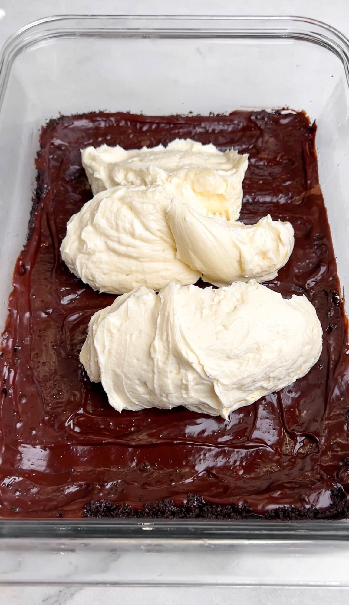 Spreading over the cream cheese mixture for oreo delight