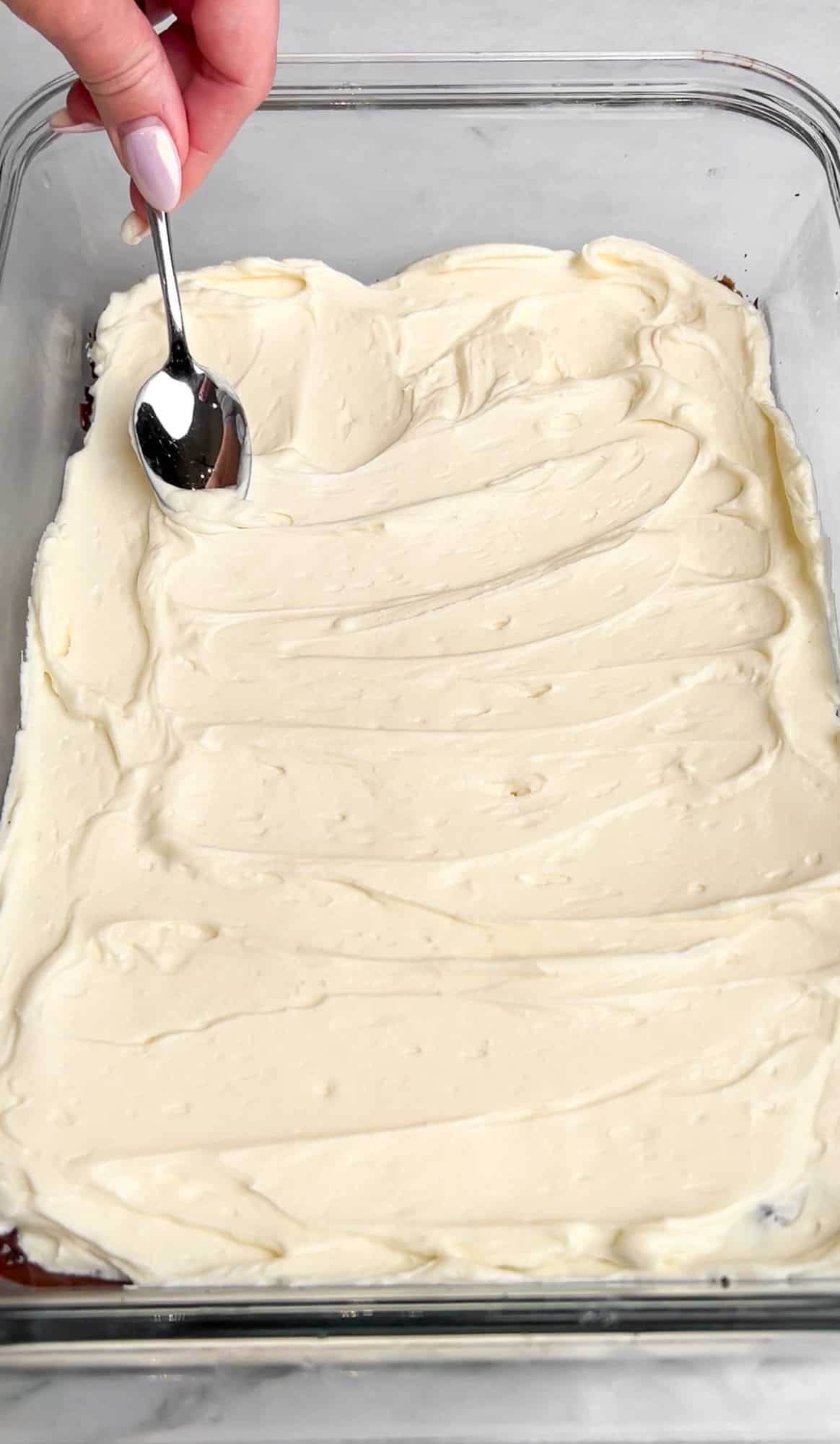 Spreading over the cream cheese mixture for oreo delight