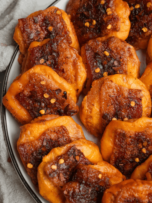 cheddar bacon crackers on a plate for a party