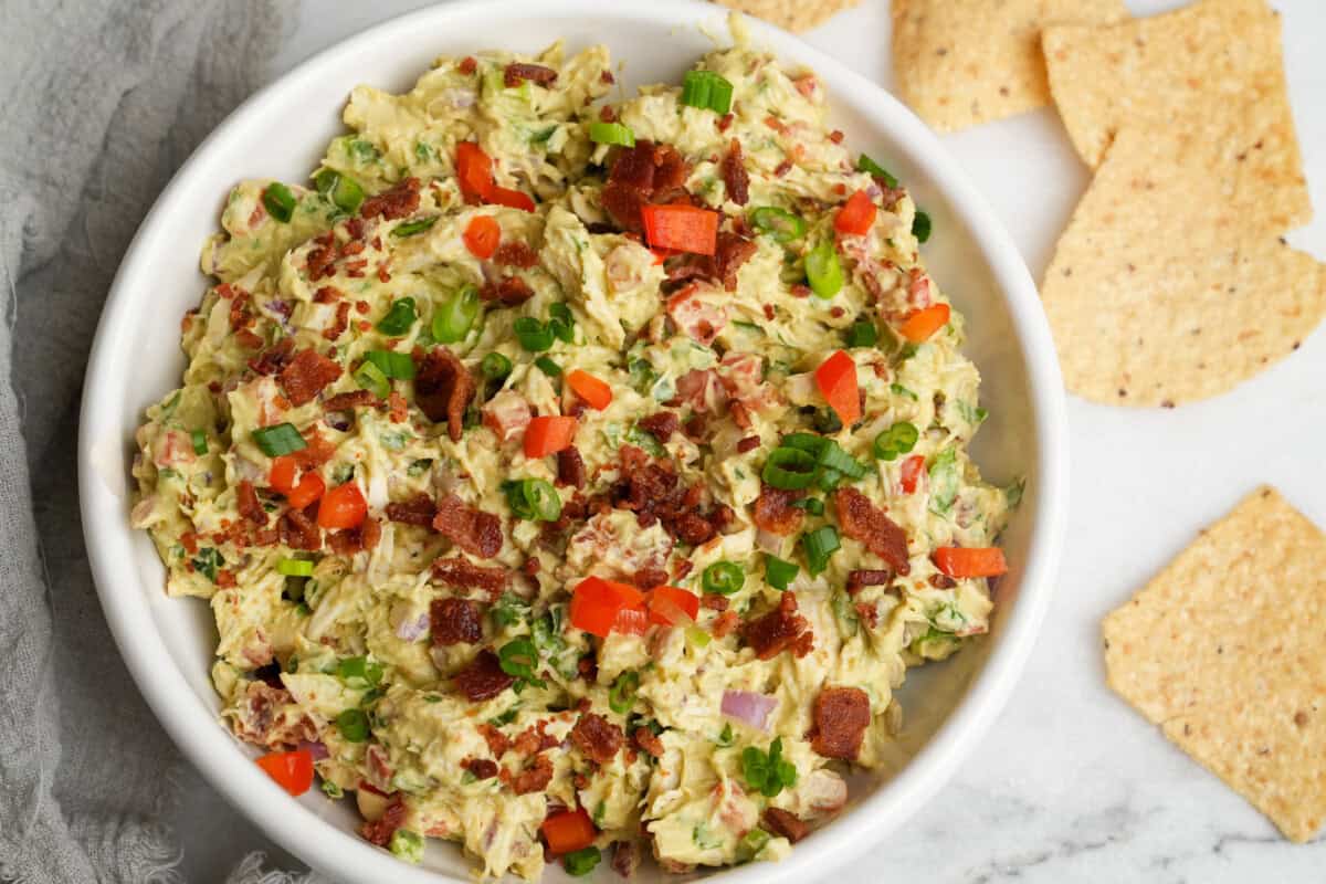 guacamole chicken salad in a bowl with chips