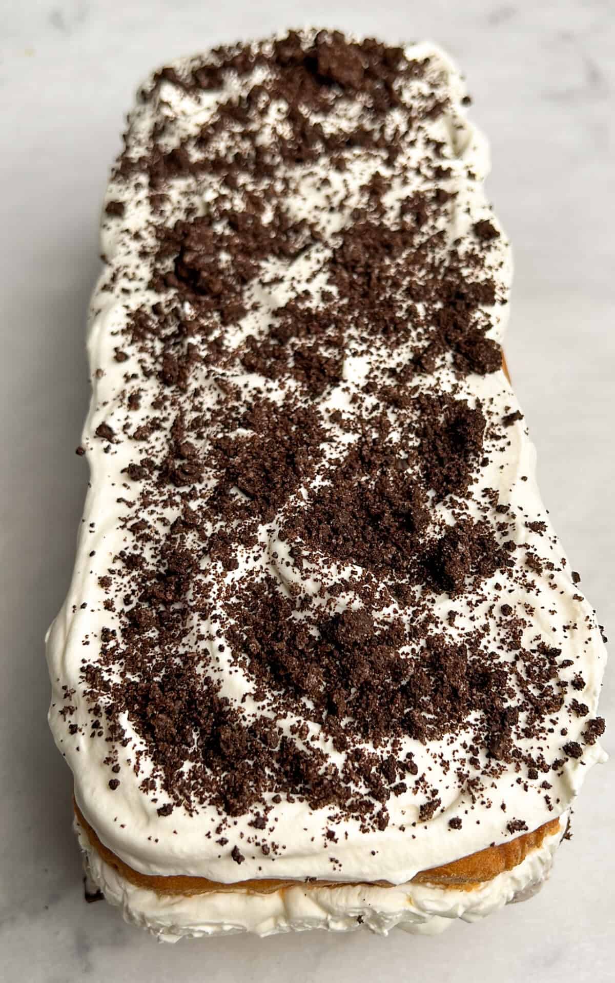 cookie crumbs on a cookies and cream ice cream cake