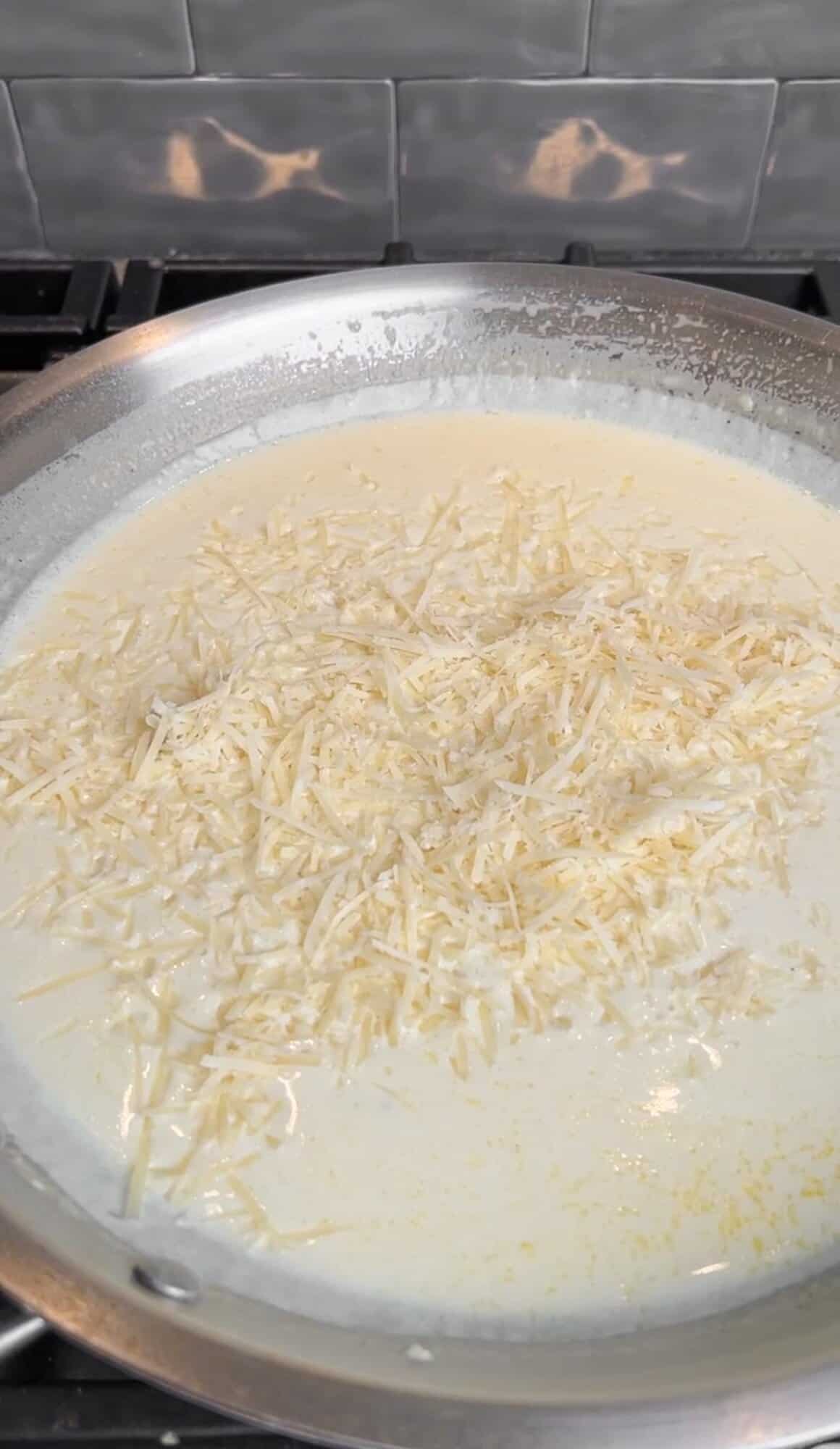 Parmesan is added to creamy lemon pasta