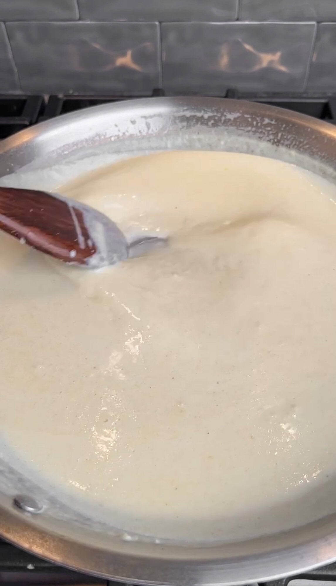 thickening the creamy lemon pasta sauce