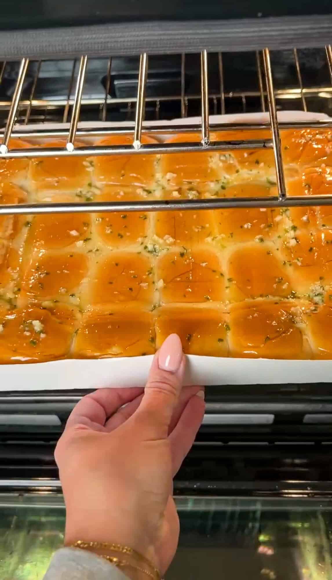 placing the rolls into the oven