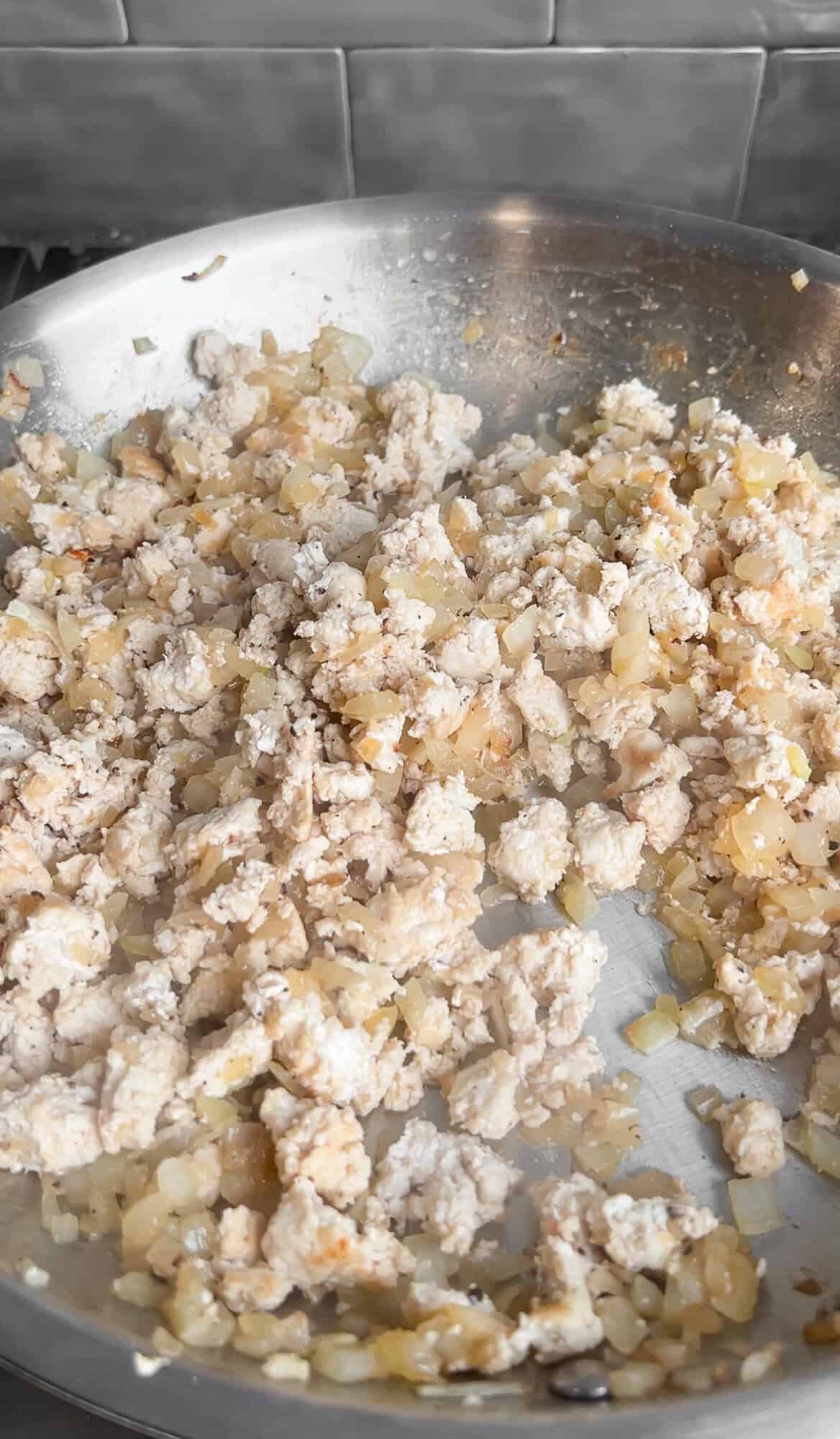 ground chicken cooking in a pan