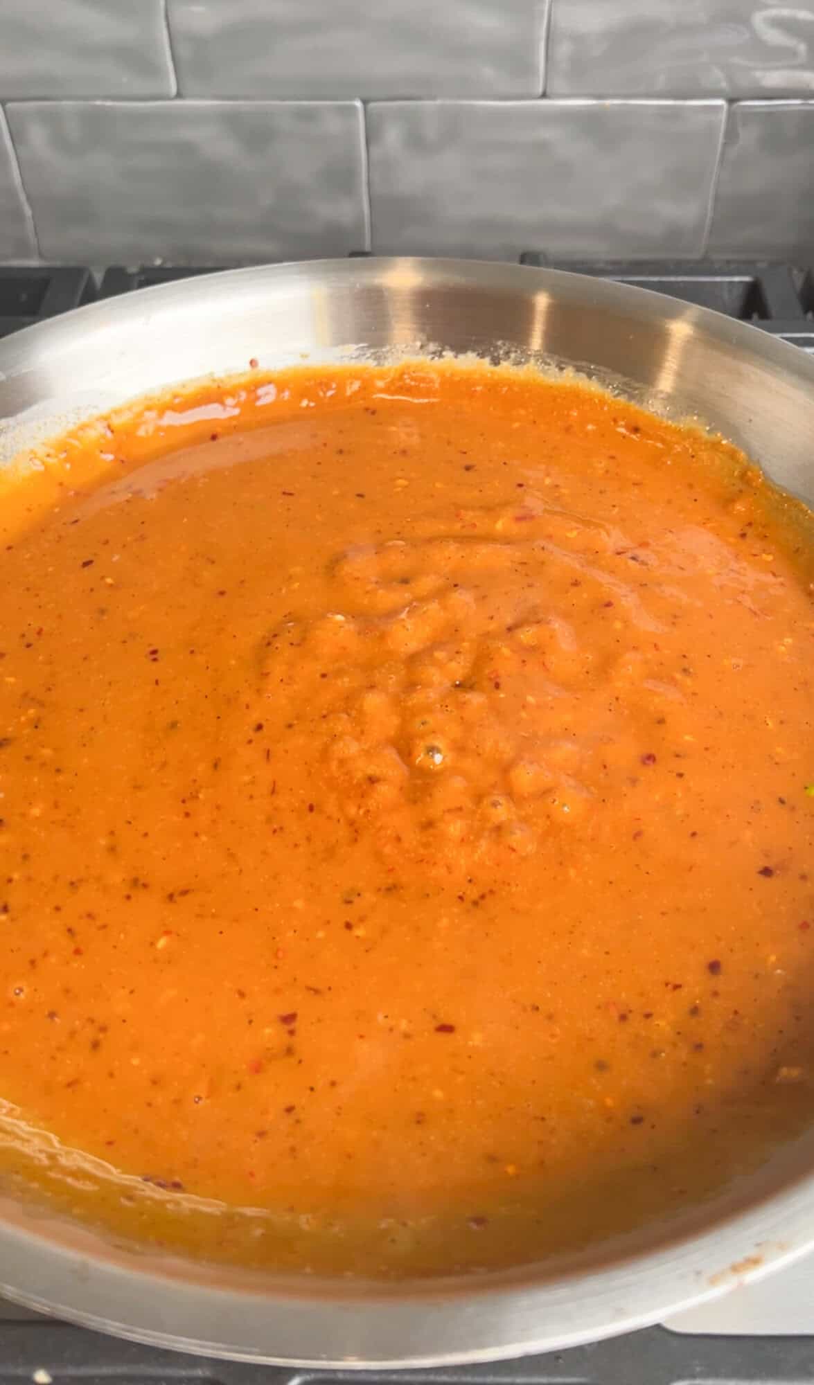 peanut chili oil sauce simmering in a pan