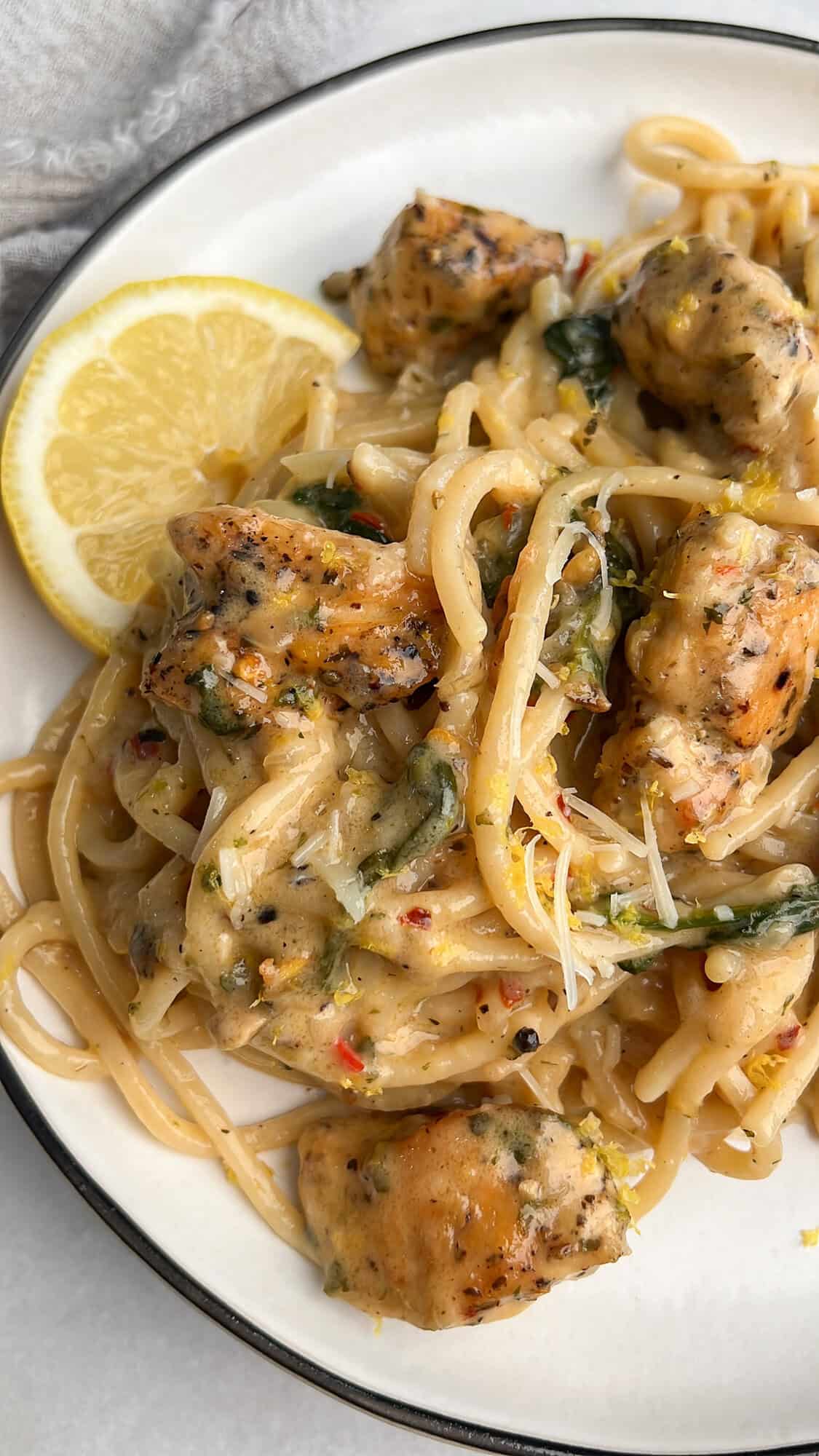 one pan chicken scampi on a plate with lemon