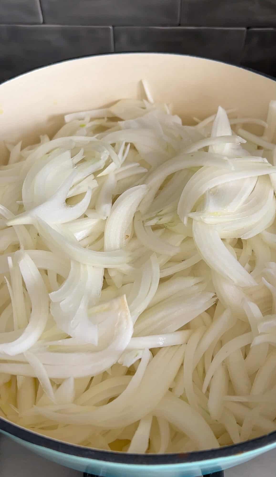 sliced onions in a pan