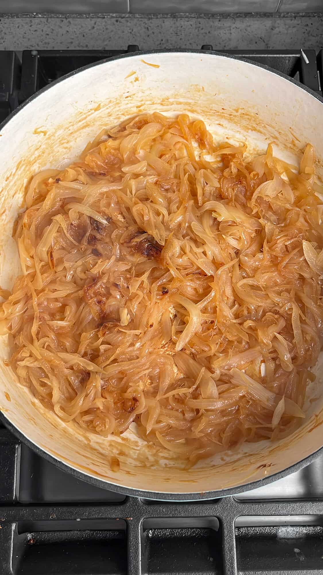 onions being caramelized in a pan