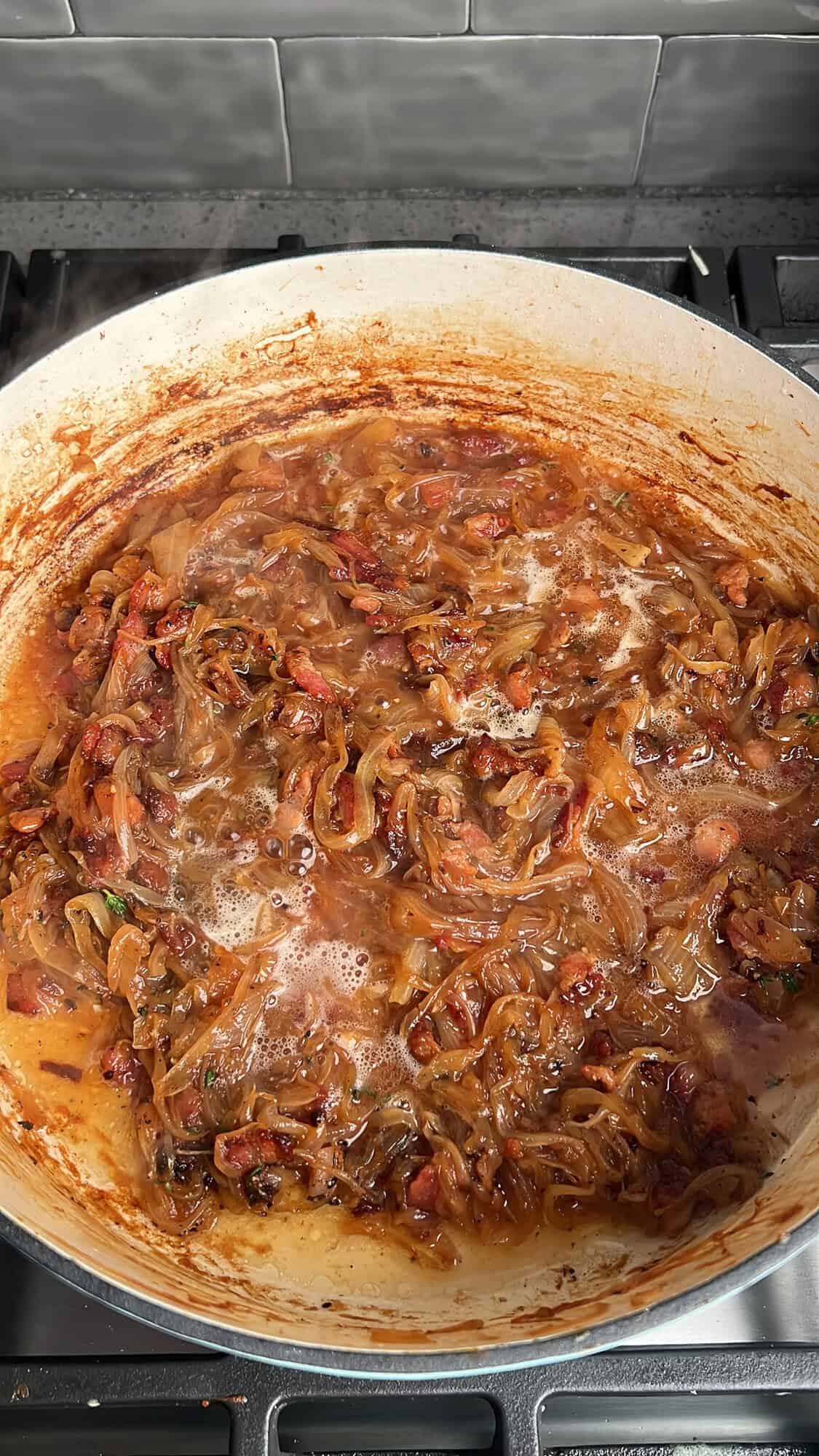 deglazing the french onion pasta pan with wine