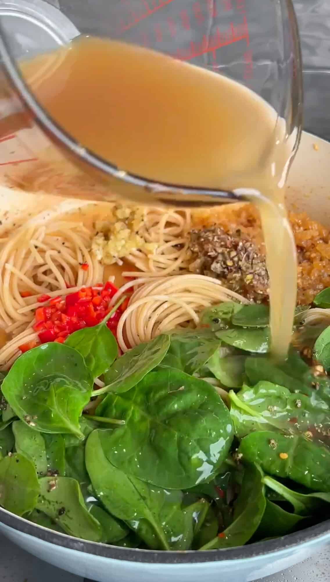 adding the pan liquid to chicken scampi