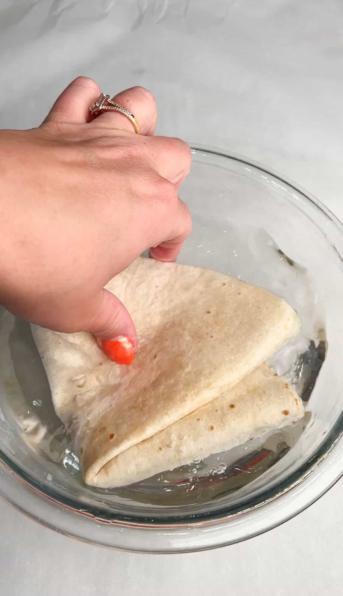 dipping tortillas in water