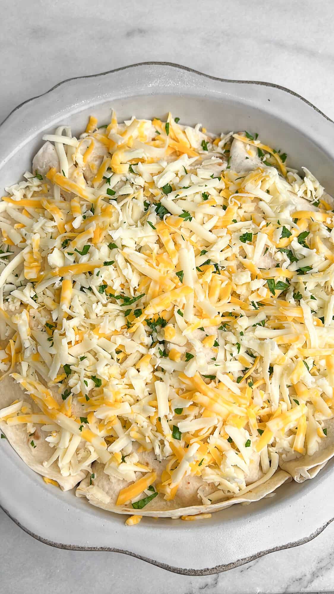 top pizzadilla with a final layer of cheese