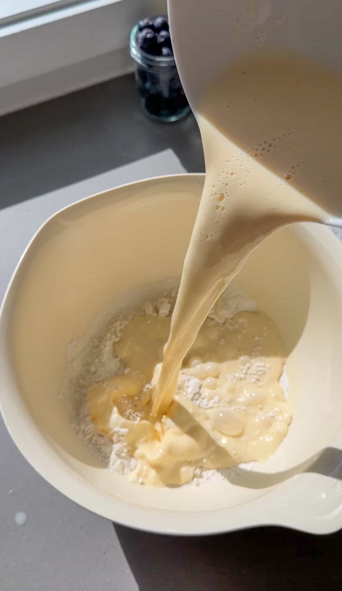 mixing the batter for dutch baby pancakes