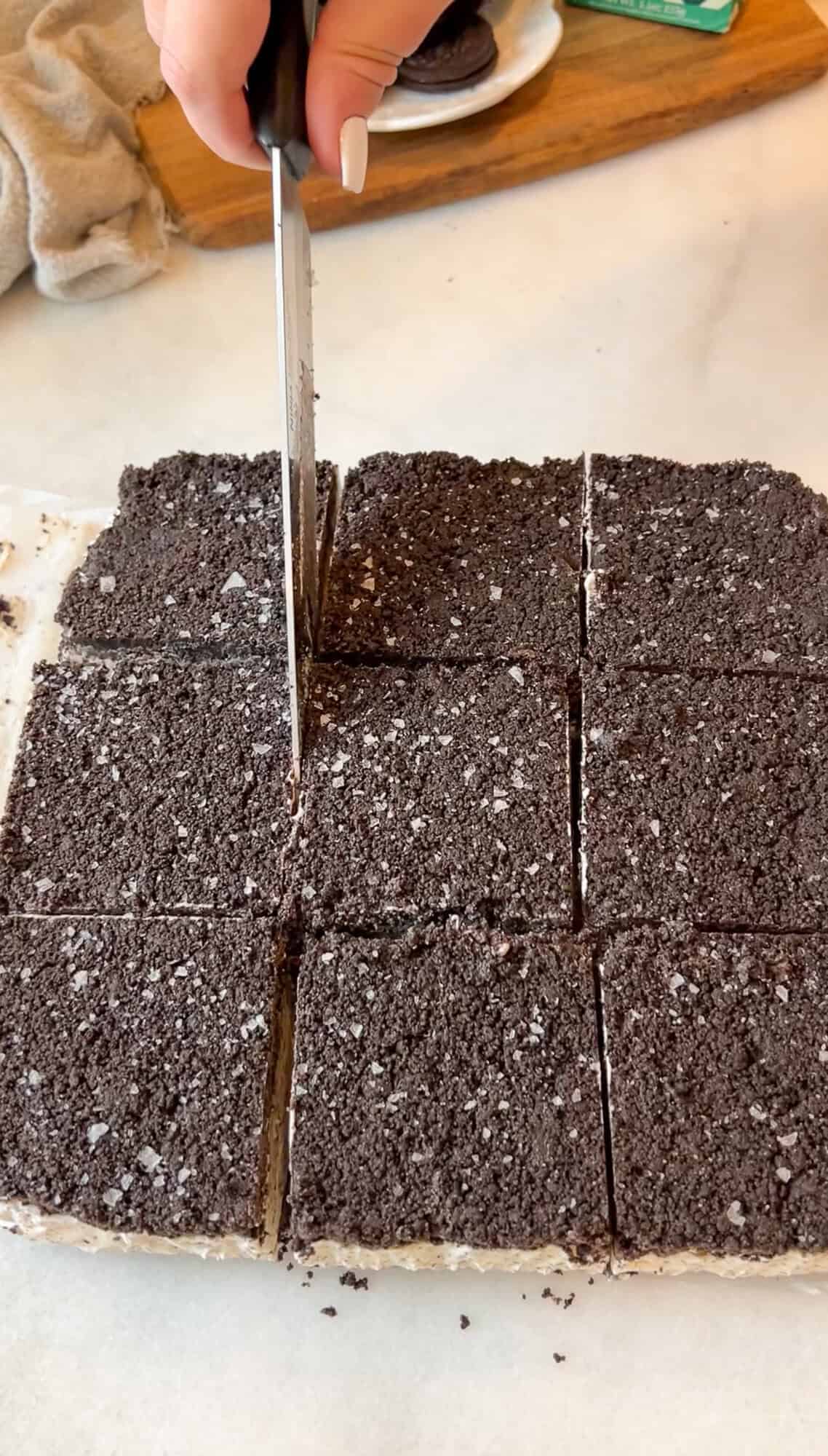 slicing the oreo ice cream sandwiches