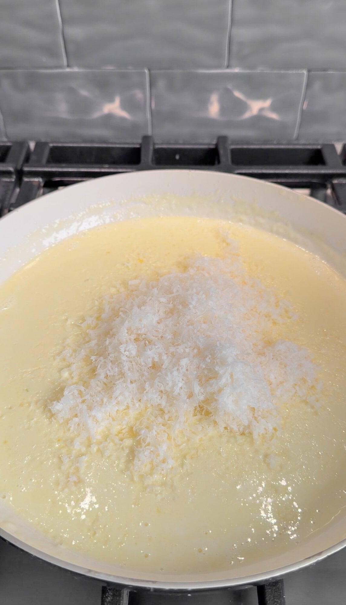 parmesan added into the creamy lemon sauce