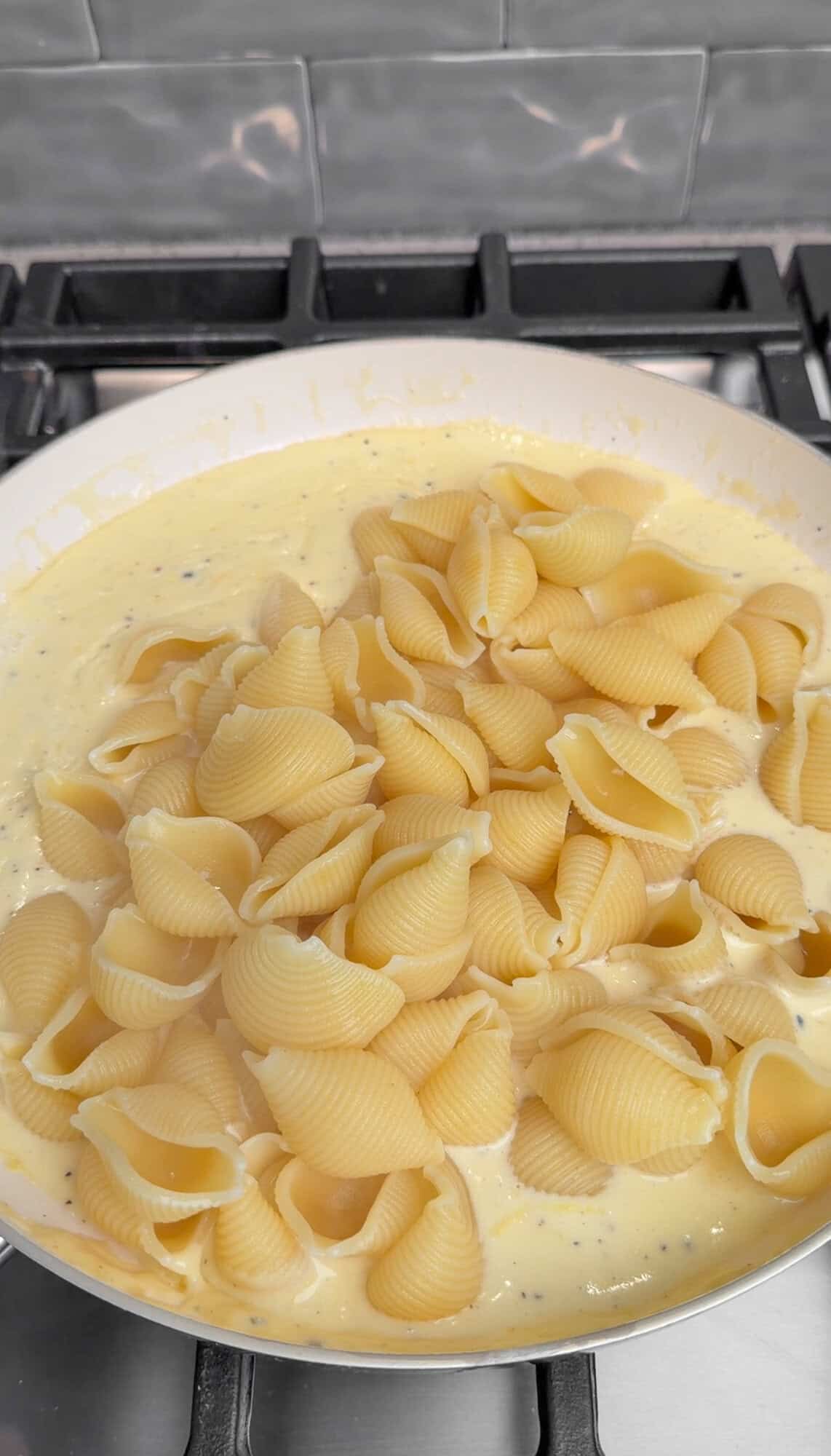 pasta al limone coming together in a pan