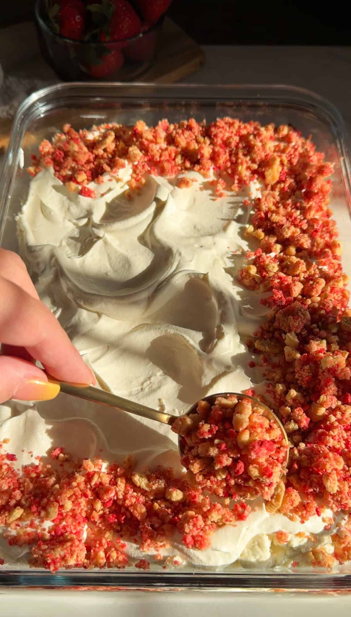 adding strawberry crunch topping