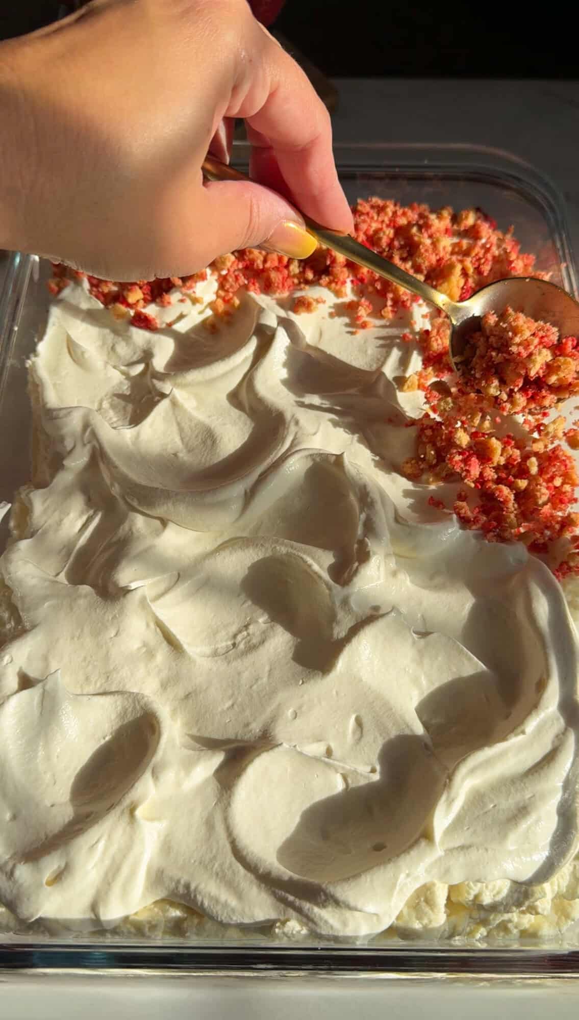 adding the strawberry crunch topping