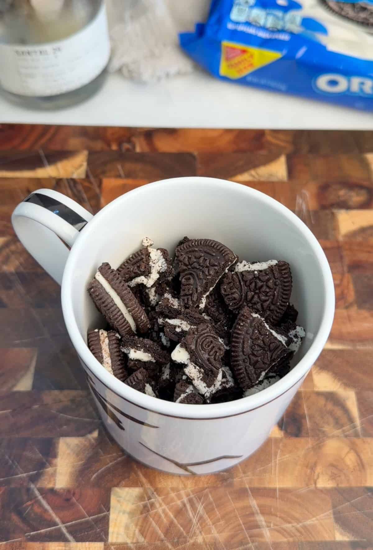 chopped oreos in a mug