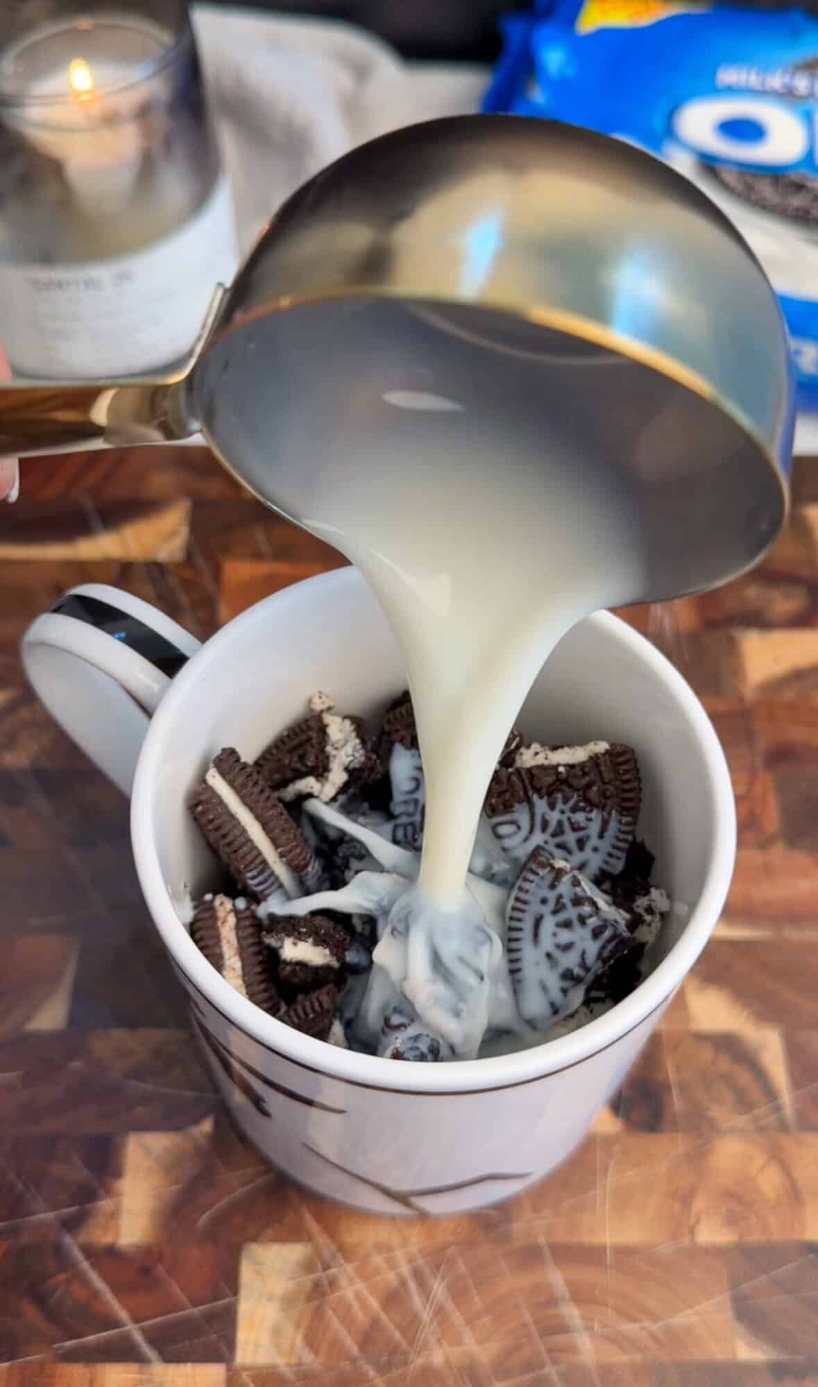 adding milk to crushed oreos